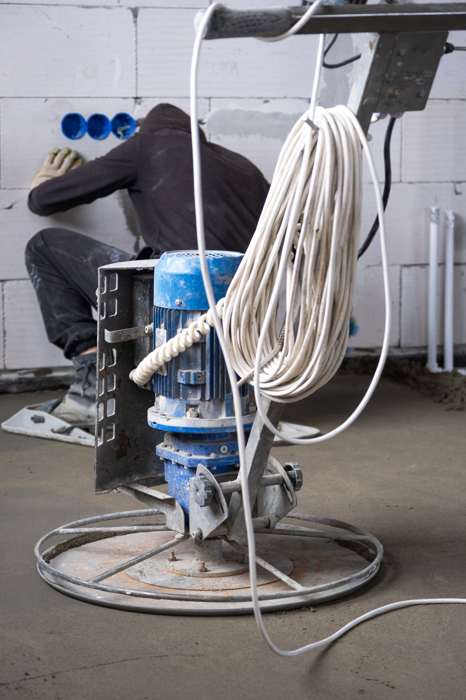 worker using concrete finishing machine in industr 2026 03 11 00 48 08 utc